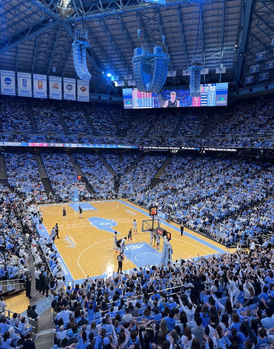 University of North Carolina (UNC) played a basketball game versus Virginia Tech on February, 17, 2024. Fans put their arms up in the air, a tradition at UNC basketball games anytime a free throw is being taken.  